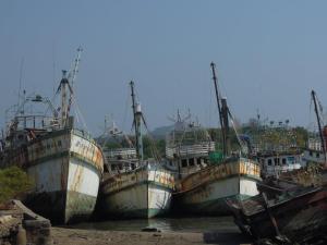 Derelict fishing trwalers at Phuket Town harbour