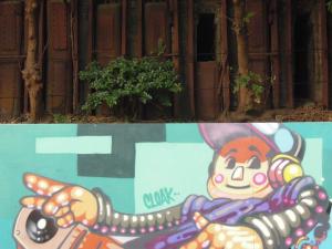 24. Graffitti below a derelict building