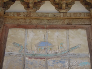 Weathered paintings on the temple exterior
